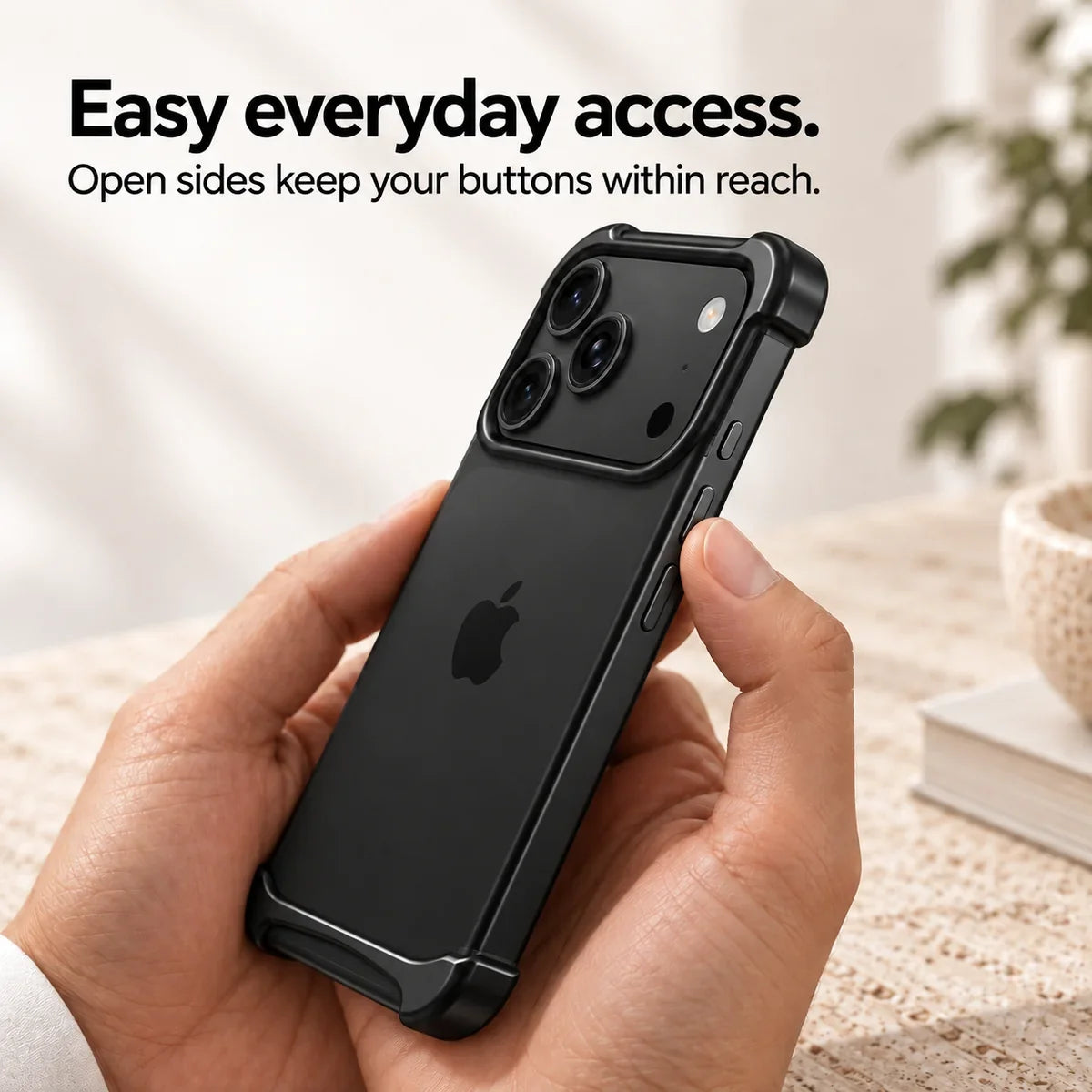 Black metal phone bumper held in hand showing access to the side buttons #color_Midnight Black