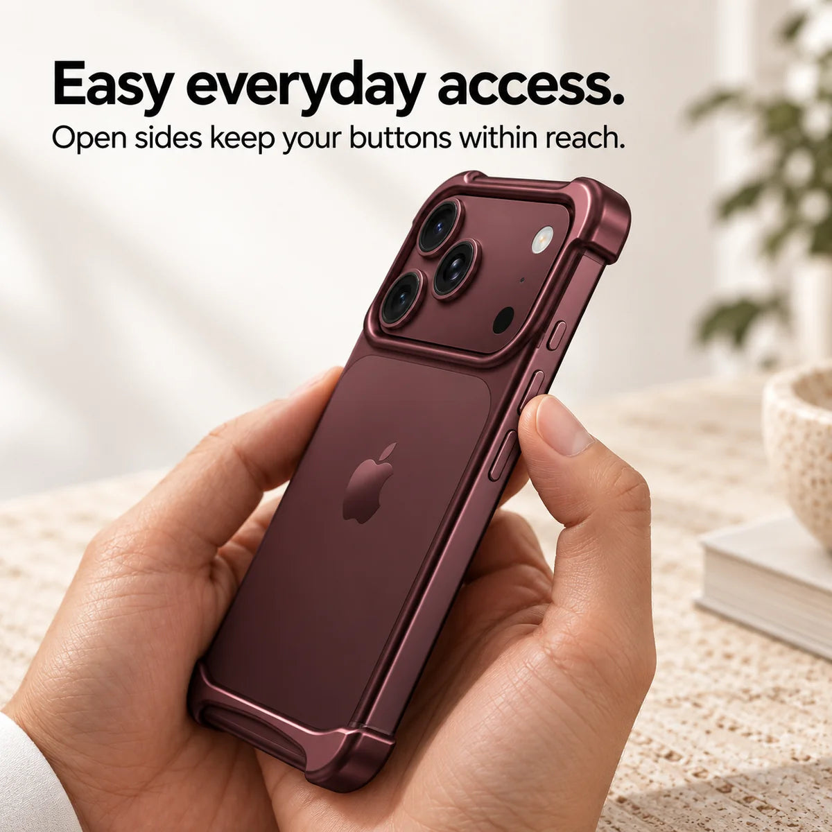 Burgundy metal phone bumper held in hand showing access to the side buttons #color_Burgundy