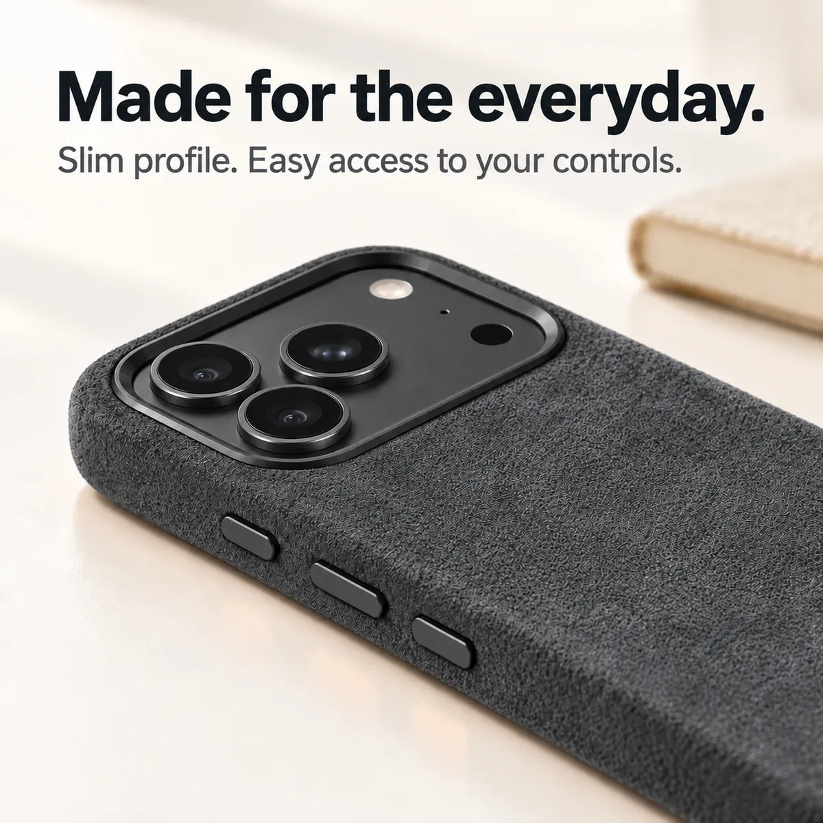 Dark gray fabric phone case with a close view of its slim side and controls. #color_Charcoal Gray