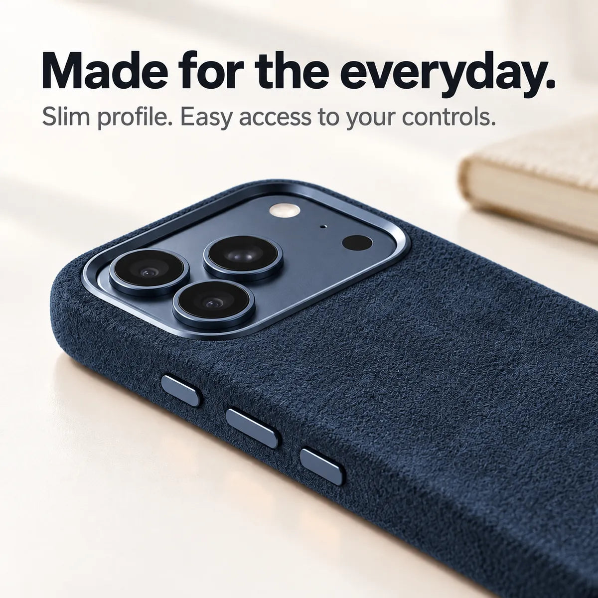 Navy blue fabric phone case with a close view of its slim side and controls. #color_Navy Blue