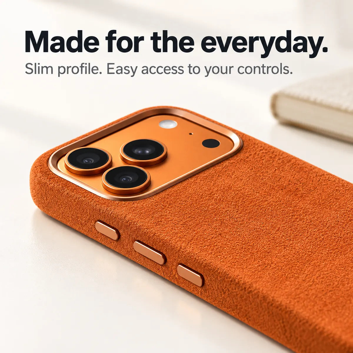 Orange fabric phone case with a close view of its slim side and controls. #color_Cosmic Orange