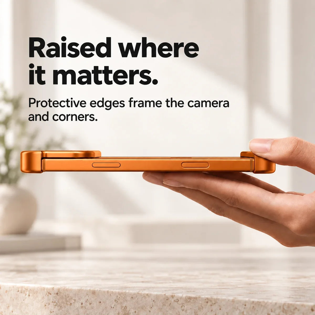 Orange metal phone bumper in a horizontal side view showing raised end protection #color_Cosmic Orange