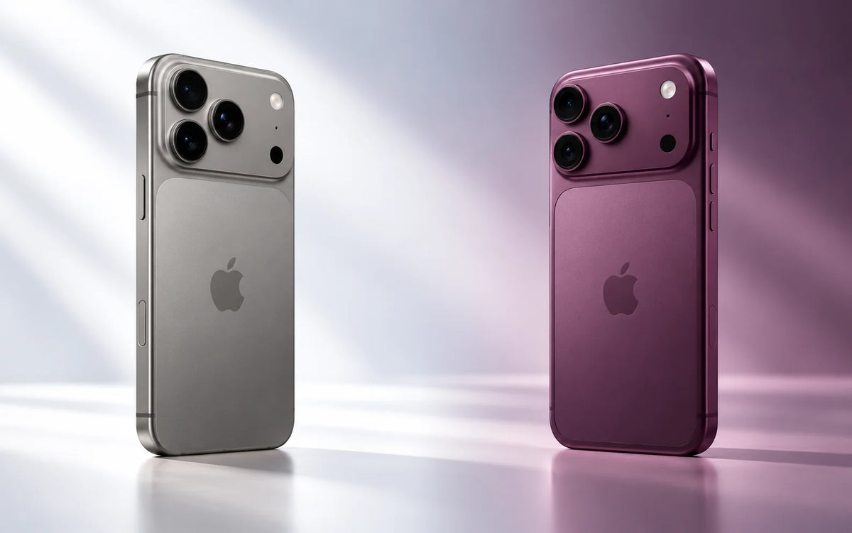 Editorial concept comparison of silver and burgundy iPhone designs against a soft studio background.
