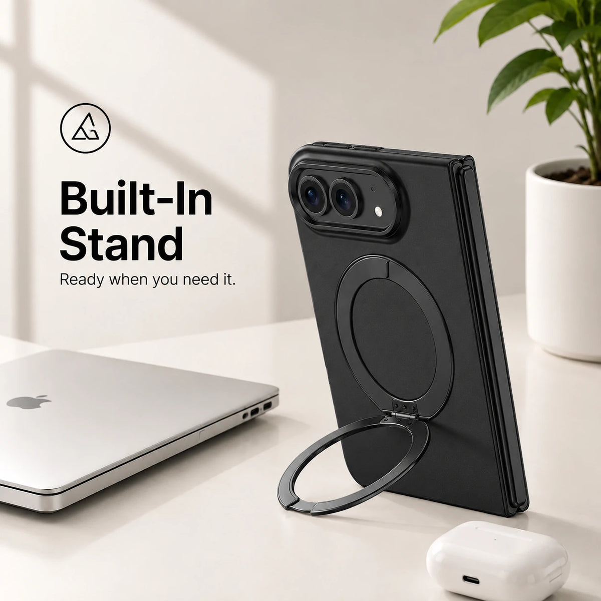 Black folding phone case standing upright with its circular built-in stand on a desk #color_Midnight Black