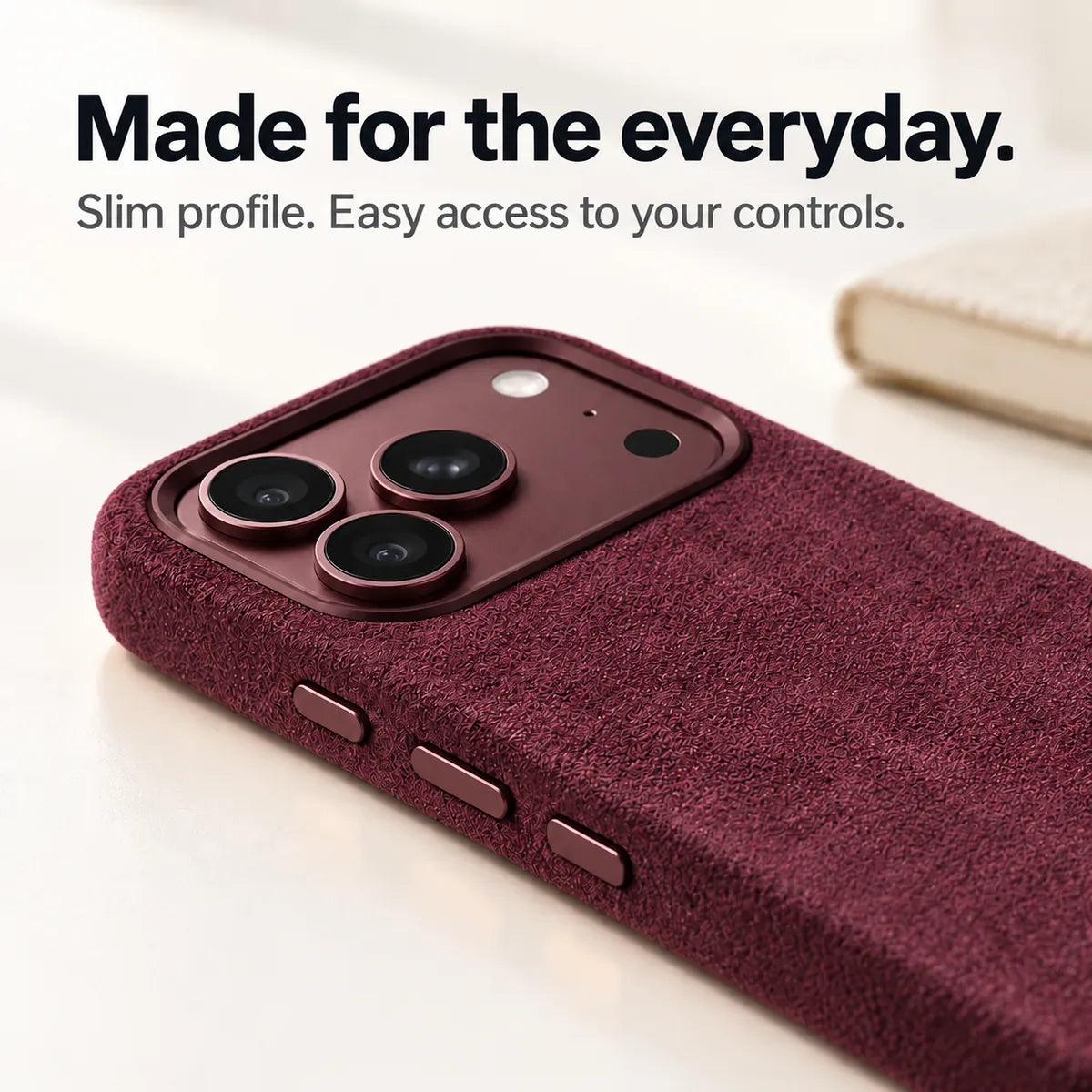 Burgundy fabric phone case with a close view of its slim side and controls. #color_Burgundy