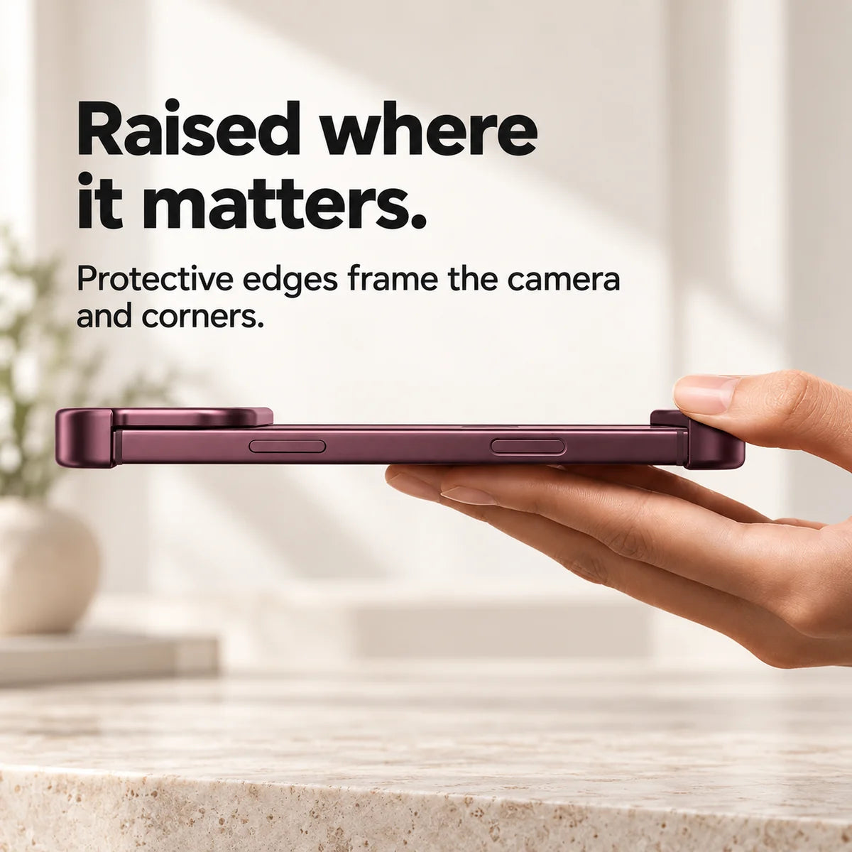 Burgundy metal phone bumper in a horizontal side view showing raised end protection #color_Burgundy