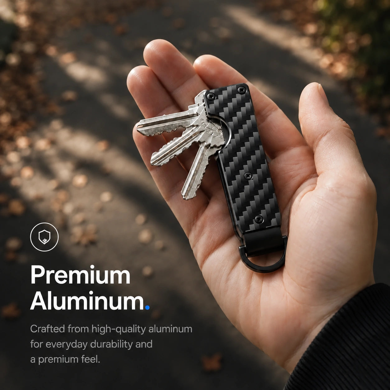 Carbon Weave compact tracking key organizer showing the exterior finish #color_Carbon Weave