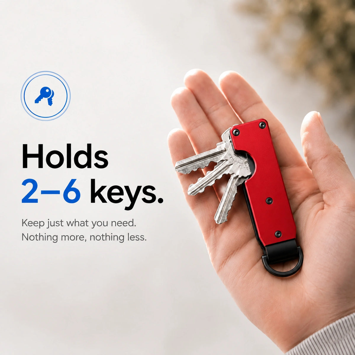 Crimson Red compact tracking key organizer holding several keys in a palm #color_Crimson Red