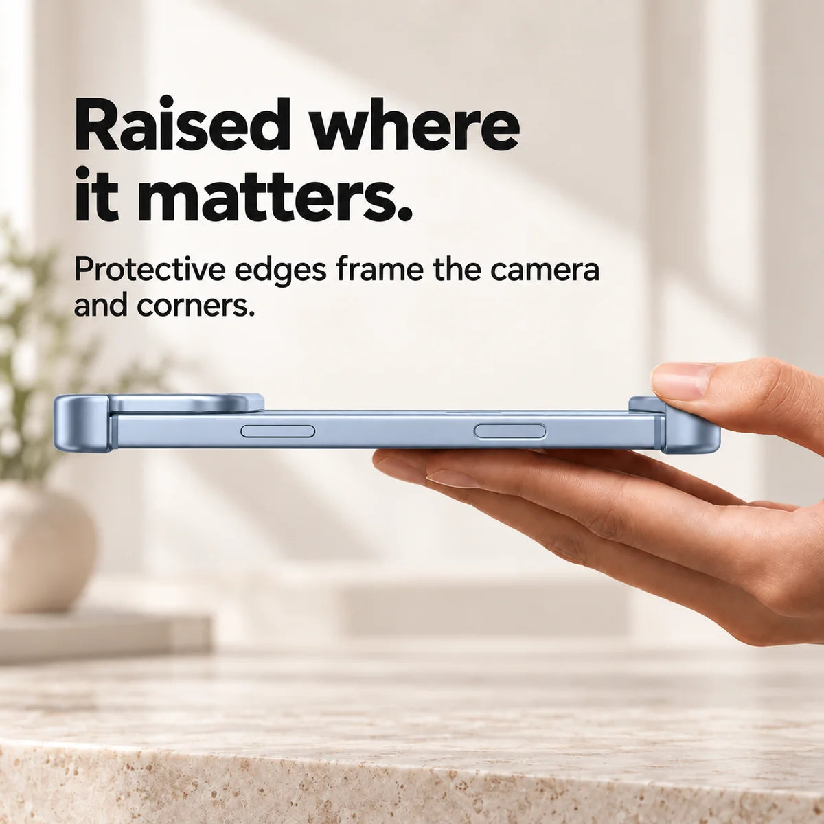 Light blue metal phone bumper in a horizontal side view showing raised end protection #color_Glacier
