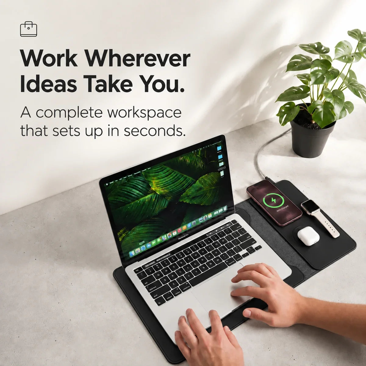 Midnight Black wireless charging laptop sleeve used as a travel desk. #color_Midnight Black