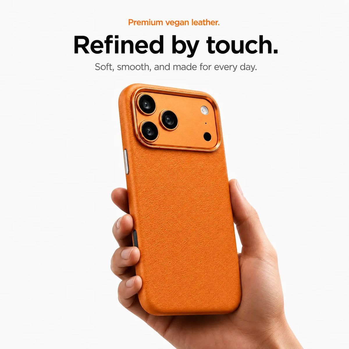 Orange textured leather phone case held upright in one hand #color_Cosmic Orange