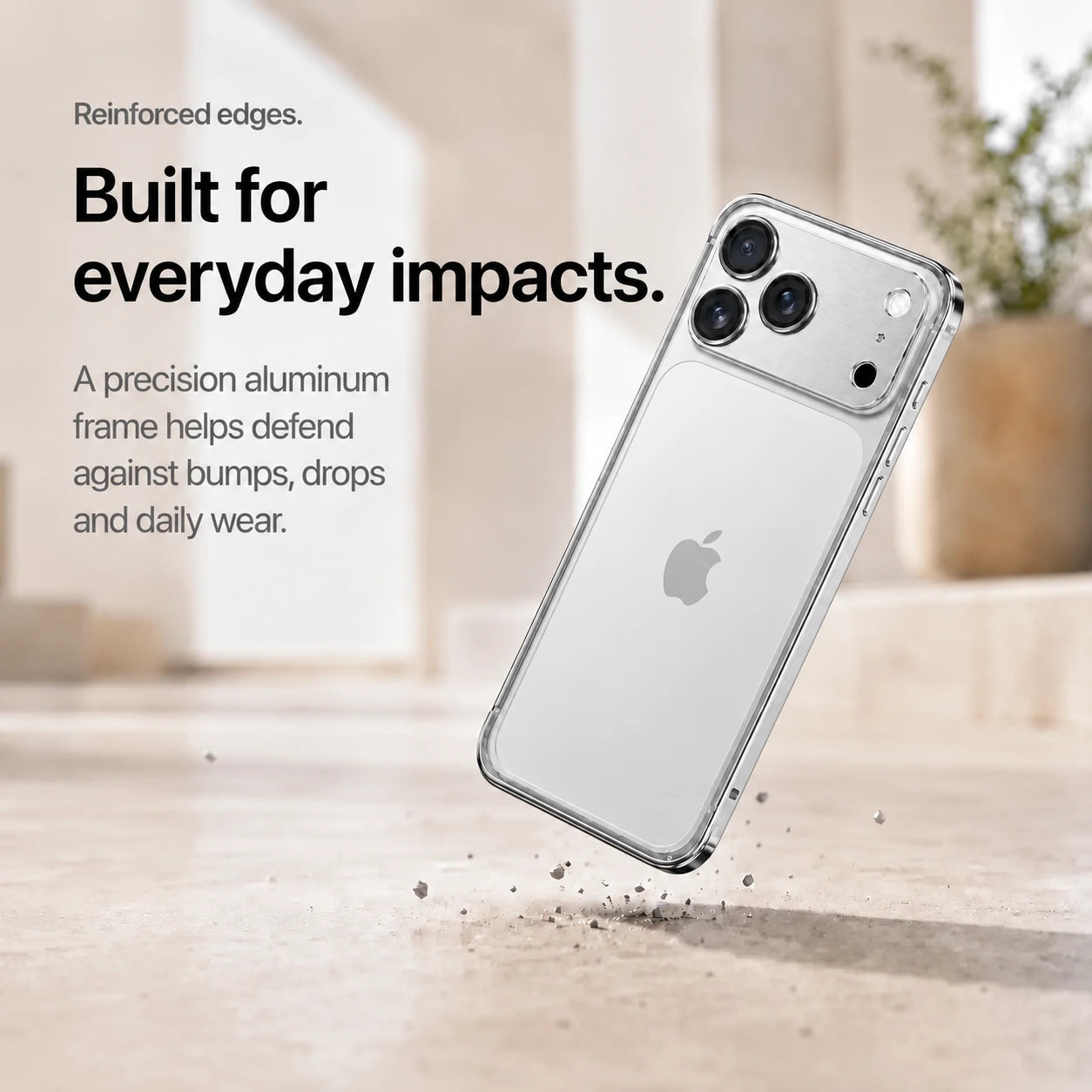 Silver aluminum frame phone case demonstrating its reinforced frame during a drop #color_Titanium Silver
