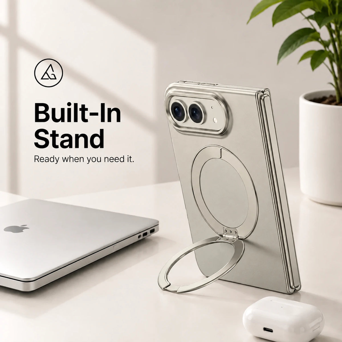 Titanium gray folding phone case standing upright with its circular built-in stand on a desk #color_Titanium Gray