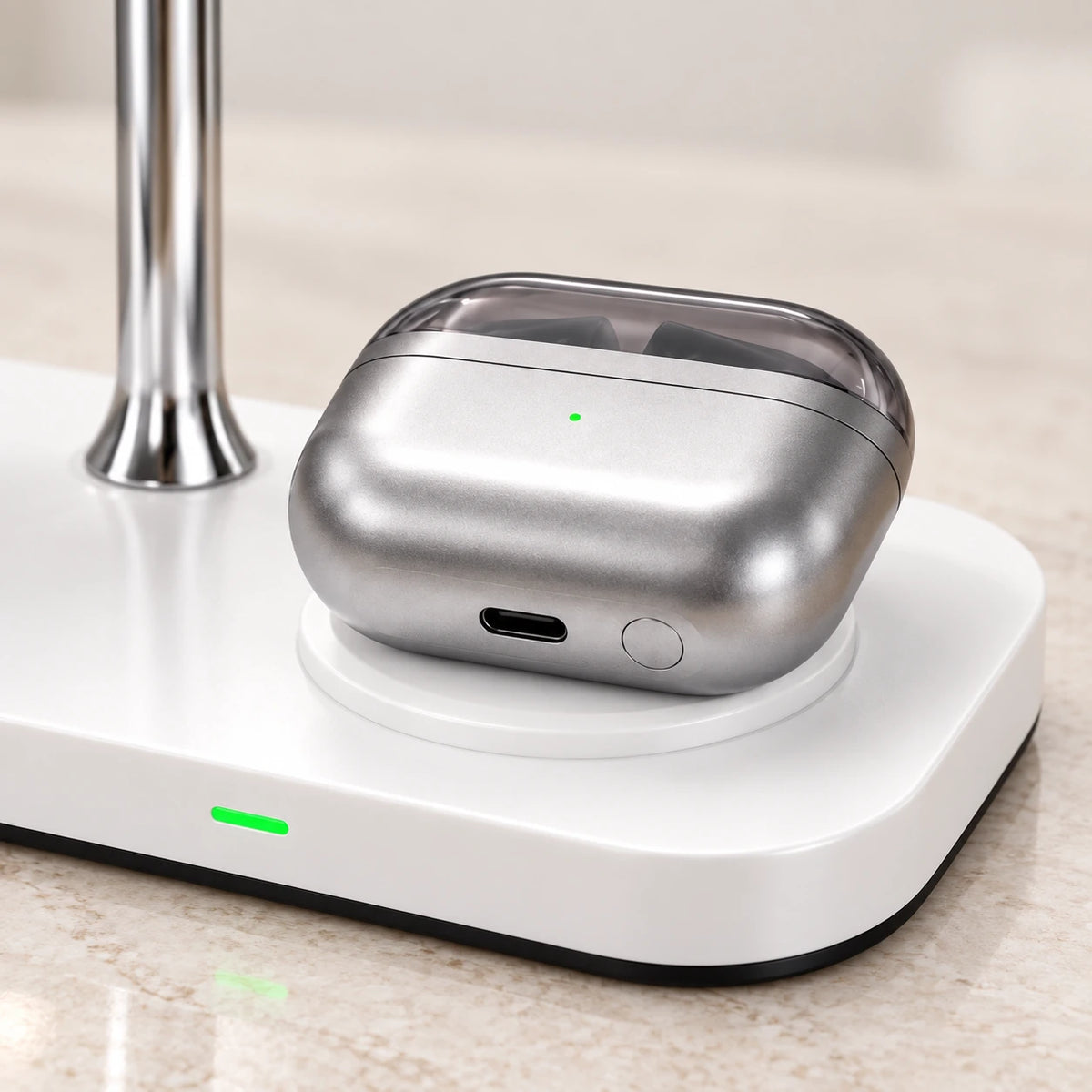 Silver earbud case sitting on the raised round pad of a white dock.